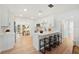 Stylish kitchen with white cabinets, a breakfast bar, and sleek countertops at 4012 W Pearl Ave, Tampa, FL 33611