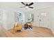 Bright living room featuring modern decor, light wood floors, and plenty of natural light at 4012 W Pearl Ave, Tampa, FL 33611
