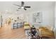 Bright living room with modern furnishings, light wood floors, and ample natural light at 4012 W Pearl Ave, Tampa, FL 33611