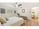 Bedroom with ceiling fan, large window, decor, and views to the dining room at 4012 W Pearl Ave, Tampa, FL 33611