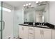 Bathroom featuring double sinks, granite countertops, and a glass enclosed shower at 4301 5Th N Ave, St Petersburg, FL 33713