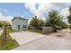 Backyard view of the two-story home featuring a spacious concrete patio for parking and outdoor activities at 4301 5Th N Ave, St Petersburg, FL 33713