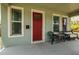 Inviting front porch with cozy seating, perfect for relaxing and enjoying the neighborhood views at 4301 5Th N Ave, St Petersburg, FL 33713