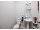 Cozy half bathroom with pedestal sink and neutral wall color at 4301 5Th N Ave, St Petersburg, FL 33713