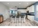 Modern kitchen with white cabinets, black countertops, and a spacious island with bar seating at 4301 5Th N Ave, St Petersburg, FL 33713