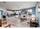 Open-concept living area with a modern kitchen featuring stainless steel appliances and a breakfast bar at 4301 5Th N Ave, St Petersburg, FL 33713