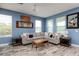 Comfortable living room with a large sectional sofa, stylish decor, and plenty of natural light at 4301 5Th N Ave, St Petersburg, FL 33713