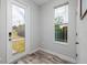 Mud room with wood-look tile flooring, exterior door, and window at 4301 5Th N Ave, St Petersburg, FL 33713