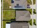 Aerial view showing solar panels, lawn, and a driveway with two vehicles at 4403 Eternal Prince, Sun City Center, FL 33573
