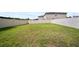A spacious backyard with a lush lawn and a privacy fence at 4403 Eternal Prince, Sun City Center, FL 33573