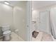 Clean bathroom featuring a toilet, sink, towel rack, and shower/tub combination at 4403 Eternal Prince, Sun City Center, FL 33573