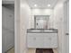 Modern bathroom featuring double sinks, granite countertops, and ample cabinet space at 4403 Eternal Prince, Sun City Center, FL 33573