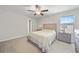 Well-lit bedroom with neutral walls, a comfortable bed, and stylish bedside tables at 4403 Eternal Prince, Sun City Center, FL 33573