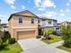 Charming home with lush lawn, showcasing neutral tones and an attached two-car garage at 4403 Eternal Prince, Sun City Center, FL 33573