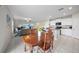 Bright open-plan living space with modern kitchen, dining area, and comfortable seating arrangement at 4403 Eternal Prince, Sun City Center, FL 33573