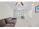 Cozy loft area with comfortable seating, a ceiling fan, and natural light at 4403 Eternal Prince, Sun City Center, FL 33573