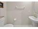 Neutral powder room featuring a pedestal sink and modern fixtures at 4403 Eternal Prince, Sun City Center, FL 33573