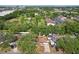 Picturesque aerial view showcasing a community with lush green spaces, swimming pool, and residential buildings at 4609 S Lois Ave, Tampa, FL 33611