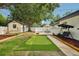 An expansive backyard is complete with a mini putting green, a shaded patio, and a hammock area at 4609 S Lois Ave, Tampa, FL 33611