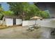 A backyard with patio, picnic tables, grill, and games for fun and relaxation at 4609 S Lois Ave, Tampa, FL 33611
