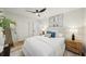 Bright bedroom with a plush bed, stylish side tables, modern art, and closet at 4609 S Lois Ave, Tampa, FL 33611