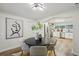 Dining room showcasing a round table, four chairs, modern decor, and kitchen access at 4609 S Lois Ave, Tampa, FL 33611
