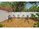 A backyard firepit area with seating provides a cozy outdoor entertainment space at 4609 S Lois Ave, Tampa, FL 33611