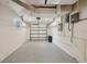 Spacious garage with durable epoxy flooring and ample room for parking and storage, ensuring a clean and functional space at 4609 S Lois Ave, Tampa, FL 33611