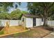 An outdoor shed with a hammock area creates a space for relaxation in this backyard at 4609 S Lois Ave, Tampa, FL 33611