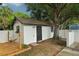 A white shed with a dark roof provides an outdoor area for rest and relaxation at 4609 S Lois Ave, Tampa, FL 33611