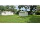 Large backyard with a storage shed, ideal for outdoor activities and storage at 4754 17Th St, Zephyrhills, FL 33542