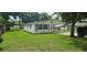 Quaint single-story home with a spacious front lawn and convenient carport at 4754 17Th St, Zephyrhills, FL 33542
