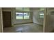 Bright living room featuring large windows and a neutral color palette at 4754 17Th St, Zephyrhills, FL 33542