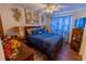 Cozy bedroom with wood-look floors and a ceiling fan and blue decorative touches at 502 Dewolf Rd, Brandon, FL 33511