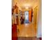 Foyer with tile flooring, an orange front door, and decorative accents at 502 Dewolf Rd, Brandon, FL 33511