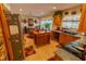 A traditionally styled kitchen with wood cabinets, granite countertops, and stainless steel appliances at 502 Dewolf Rd, Brandon, FL 33511
