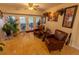 A comfortable living room with ample natural light, featuring tile flooring at 502 Dewolf Rd, Brandon, FL 33511