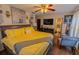Serene primary bedroom with a bed, a TV, and an en-suite bathroom at 502 Dewolf Rd, Brandon, FL 33511