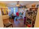 Well-lit home office with a ceiling fan and laminate floors with plenty of storage at 502 Dewolf Rd, Brandon, FL 33511