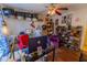 Functional home office with a ceiling fan, shelving, and space for multiple desks at 502 Dewolf Rd, Brandon, FL 33511