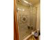 Modern shower with glass doors, a built-in bench, and decorative tile at 502 Dewolf Rd, Brandon, FL 33511