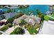 Beautiful waterfront home with lush landscaping, a private boat dock, and convenient access to the open water at 511 Island Way, Clearwater Beach, FL 33767