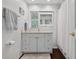 Bathroom featuring a white vanity, mirror and shower with curtain at 511 Island Way, Clearwater Beach, FL 33767