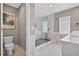 Updated bathroom with glass-enclosed shower, toilet, and modern vanity at 511 Island Way, Clearwater Beach, FL 33767