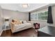 Bedroom featuring a daybed, floral chair and window at 511 Island Way, Clearwater Beach, FL 33767
