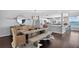 Elegant dining space with stylish lighting, seating for six, and beautiful water views at 511 Island Way, Clearwater Beach, FL 33767