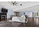 Spacious living room with a fireplace, hardwood floors, and large windows that provide plenty of natural light and scenic views at 511 Island Way, Clearwater Beach, FL 33767