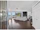 Open-concept living room with hardwood floors, fireplace and waterfront view at 511 Island Way, Clearwater Beach, FL 33767