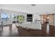 Bright living room with water views, fireplace, and seamless access to the outdoor patio at 511 Island Way, Clearwater Beach, FL 33767