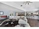 Open-concept living room with high ceilings, dark wood floors, and bar seating at 511 Island Way, Clearwater Beach, FL 33767